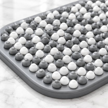 Close-up of gray and white raised bath mat bumps
