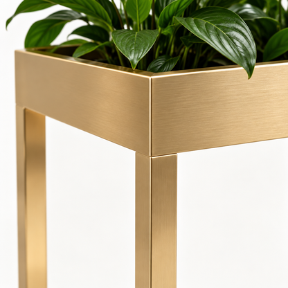 Detail of gold-tone planter box edge and legs