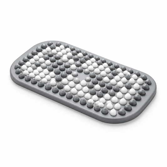 Gray and white textured bath mat on white background